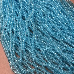 Намистини Чеський Кришталь на волосіні блакитне прозоре гранований рондель d-3х2,5мм + - L-36-38см + - купити