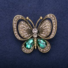 Брошка Метелик з зеленими каменями 50х44мм жовтий метал купити біжутерію дешево в інтернеті