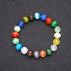 Браслет натуральний камінь Котяче око різнокольоровий гладка кулька d-10мм L-18см на резинці купити біжутерію