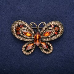 Брошка Метелик з коричневими каменями 34х54мм жовтий метал купити біжутерію дешево в інтернеті