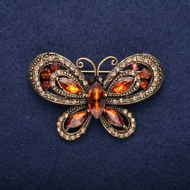 Брошка Метелик з коричневими каменями 34х54мм жовтий метал купити біжутерію дешево в інтернеті