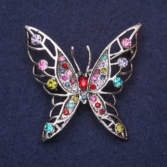 Брошка Метелик з рожевими блакитними зеленими стразами камінням 45х47мм сріблястий метал купити біжутерію