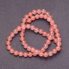 Намистини з натурального каменю Халцедон рожевий на волосіні гладка кулька d-4мм L-38см купити біжутерію