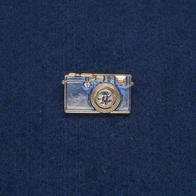 Брошка Фотоапарат золотистий метал з блакитною емаллю і білими каменями 30х17 мм + - купити біжутерію дешево в