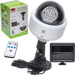 Вуличний світлодіодний ліхтар муляж камери із сонячною батареєю, датчиком руху та пультом управління JX-5118 купити дешево в