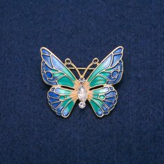 Брошка Метелик з білими кристалами і різнобарвною емаллю, золотистий метал 31х37мм купити біжутерію дешево в