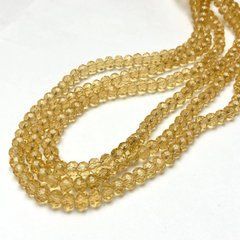 Намистини Чеський Кришталь на волосіні жовте медовий прозоре гранований рондель d-8х6мм + - L-40-42см + -