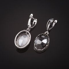 Сережки з сірими кристалами оправа "зубчик" овальний камінь 2 * 1,6см L-4см купити біжутерію дешево в