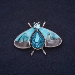 Брошка Метелик 40х27мм камені емаль колір синій чорний метал сріблястий купити біжутерію дешево в інтернеті