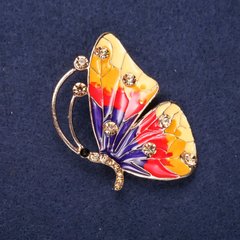 Брошка Метелик з жовтими стразами жовтий, червоний і фіолетовий колір емалі 45х32мм жовтий метал купити